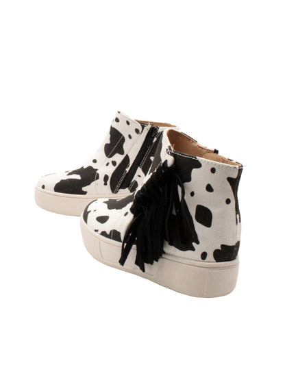 The ‘Lance’ fringed sneaker bootie by Volatile Kids is designed for little feet going to big places and is the comfiest way to take part in the Western trend. They have inside zippers to make them easy to slip on and off, while the textured rubber sneaker bottom provides traction and stability. These work equally well with skirts and pants alike. black white cow 4 