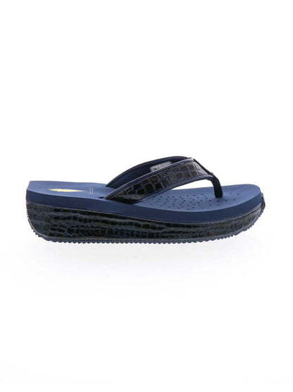 The Mini Croco thong wedge sandal by Volatile is crafted from a luxe, glossy faux crocodile material and gives a modest lift in height with the comfortable 1 1/2” wedge. They feature Volatile’s signature ultra comfort EVA insole for all day comfort, padded textile lining that rests gently on the skin, and nonskid rubber traction outsoles to keep feet grounded on all surfaces.  navy