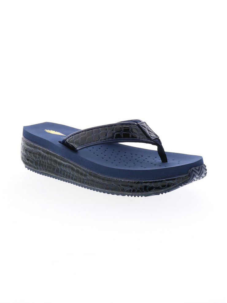 The Mini Croco thong wedge sandal by Volatile is crafted from a luxe, glossy faux crocodile material and gives a modest lift in height with the comfortable 1 1/2” wedge. They feature Volatile’s signature ultra comfort EVA insole for all day comfort, padded textile lining that rests gently on the skin, and nonskid rubber traction outsoles to keep feet grounded on all surfaces.  navy 2