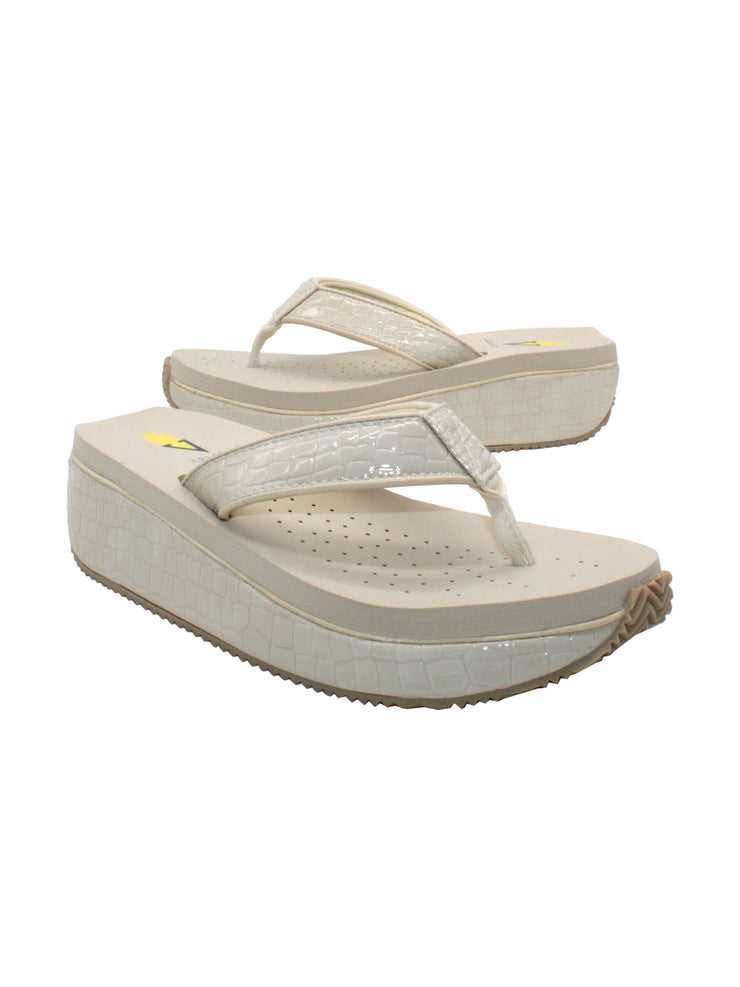  The Mini Croco thong wedge sandal by Volatile is crafted from a luxe, glossy faux crocodile material and gives a modest lift in height with the comfortable 1 1/2” wedge. They feature Volatile’s signature ultra comfort EVA insole for all day comfort, padded textile lining that rests gently on the skin, and nonskid rubber traction outsoles to keep feet grounded on all surfaces.  off white 2