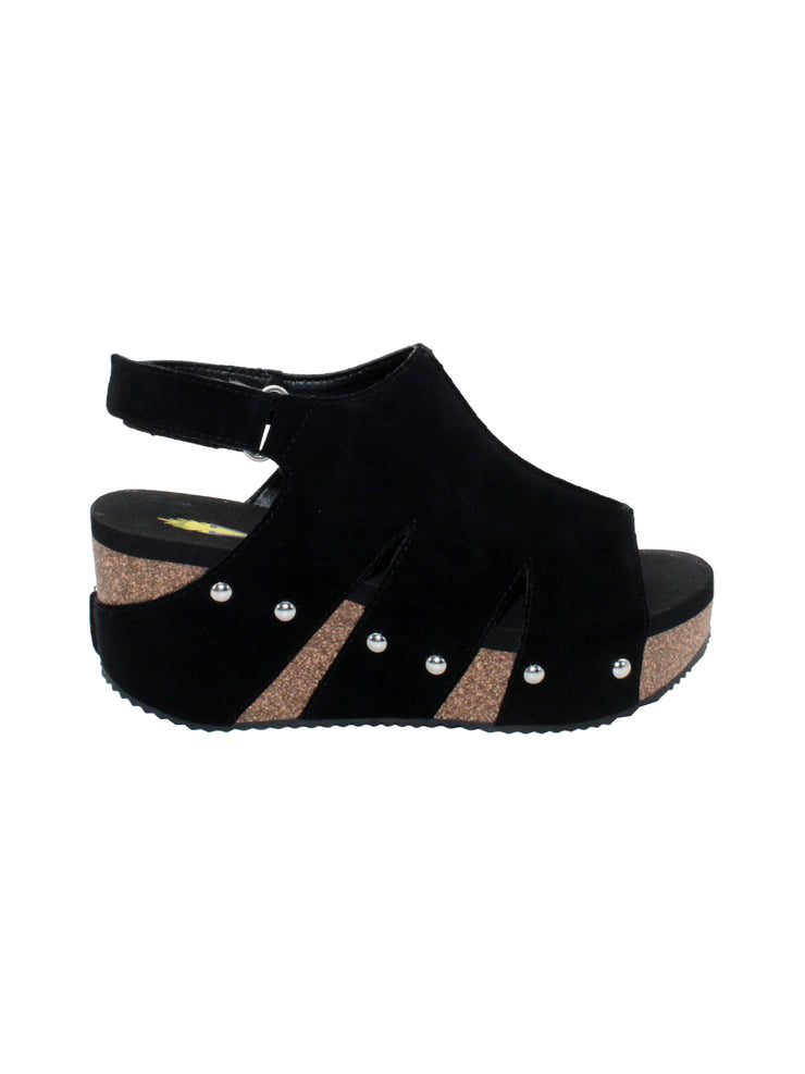 olatile’s ‘Montpelier’ wedge sandal is made in plush genuine suede with a butted center seam and side cut outs that have been secured by metal clog studs on the cork wedge. They feature Volatile’s signature ultra-comfort EVA insole and non-skid rubber traction outsole ideal for walking on all surfaces. Try them with printed shirt dresses or flared denim. black 