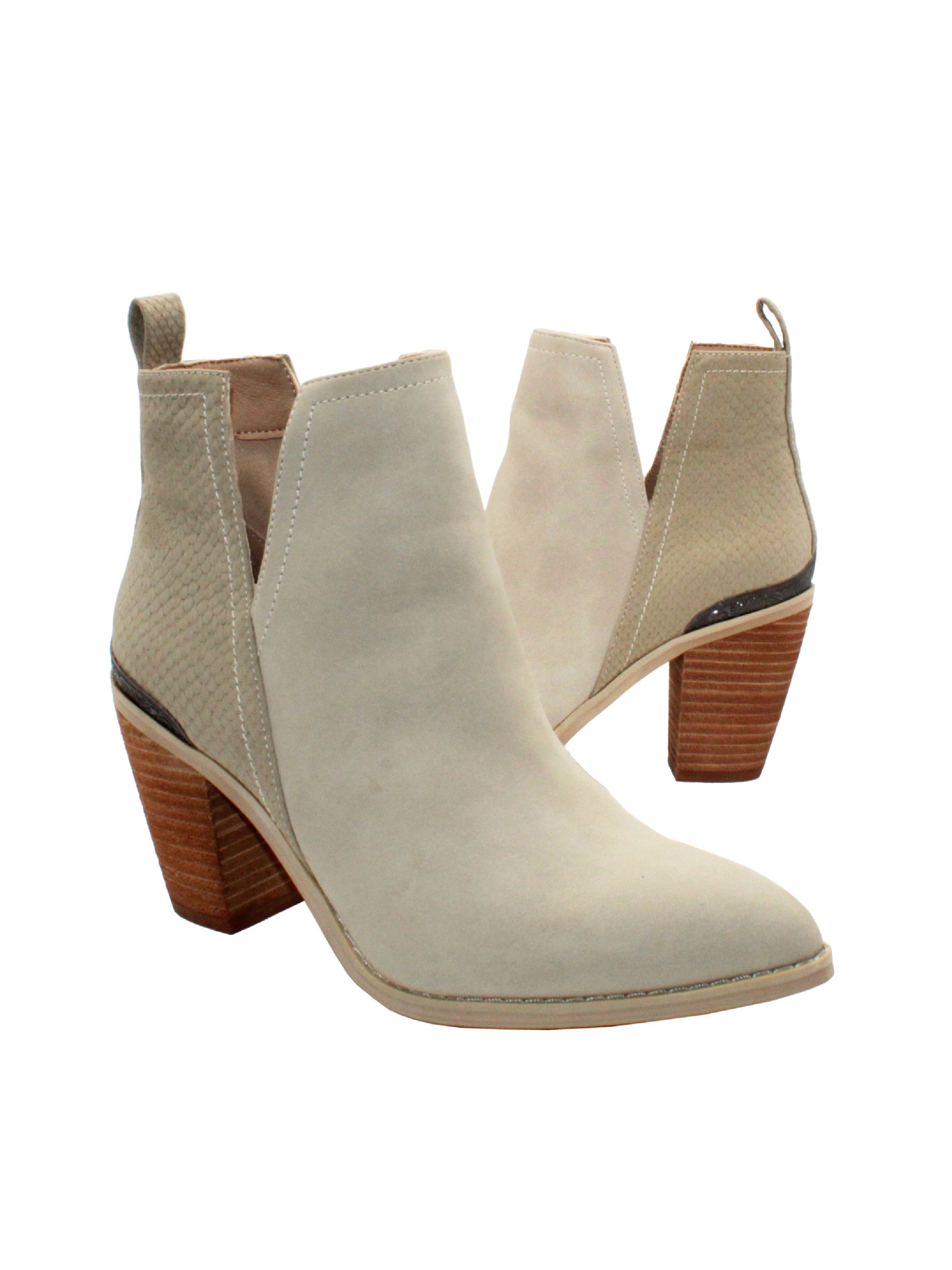 Very Volatile’s ‘Mumba’ open shank, pull-on bootie can complete any look in your fall wardrobe with its genuine hair calf or faux exotic upper. Set on a stacked leather heel, this pair nods to the Western trend with a burnished metal heel rand and tapered toe shape. Wear them with everything from skinny jeans to feminine dresses.