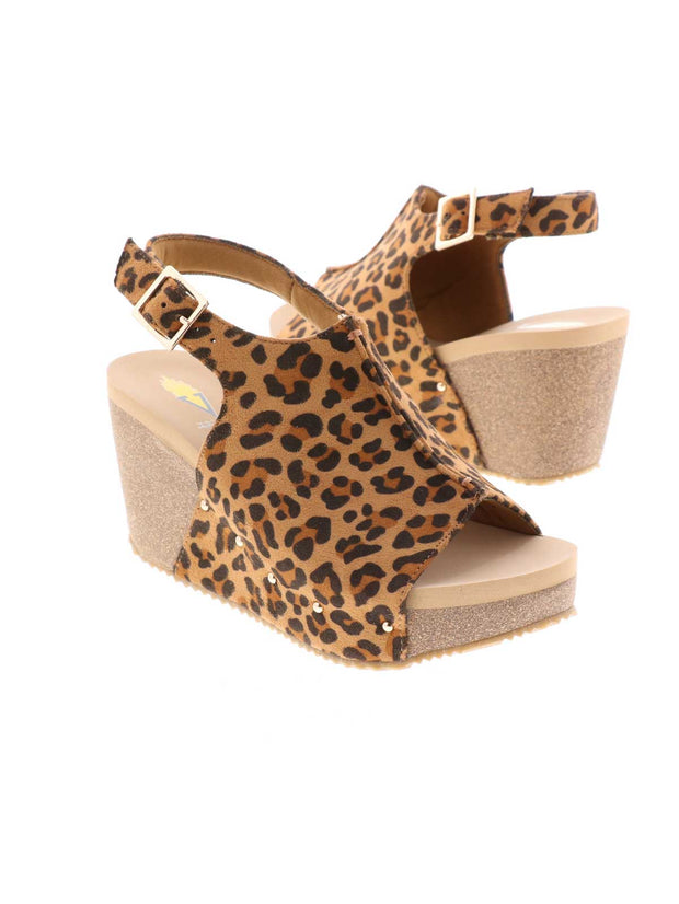 One of Volatile’s classic signature styles, the leopard Division wedge sandal brings ultra-comfort to casual fashion like no other. The adjustable ankle strap offers stability, the padded lining and signature ultra-comfort EVA insole keeps feet feeling rested even after a full day of adventure, and the rubber traction outsole means these are safe for walking on any surface. Pack these for your next trip to wear with shorts for sightseeing and a flowy dress for special events. 2
