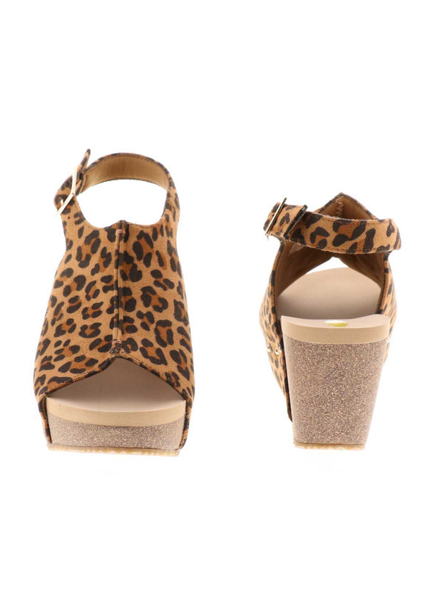 One of Volatile’s classic signature styles, the leopard Division wedge sandal brings ultra-comfort to casual fashion like no other. The adjustable ankle strap offers stability, the padded lining and signature ultra-comfort EVA insole keeps feet feeling rested even after a full day of adventure, and the rubber traction outsole means these are safe for walking on any surface. Pack these for your next trip to wear with shorts for sightseeing and a flowy dress for special events.3
