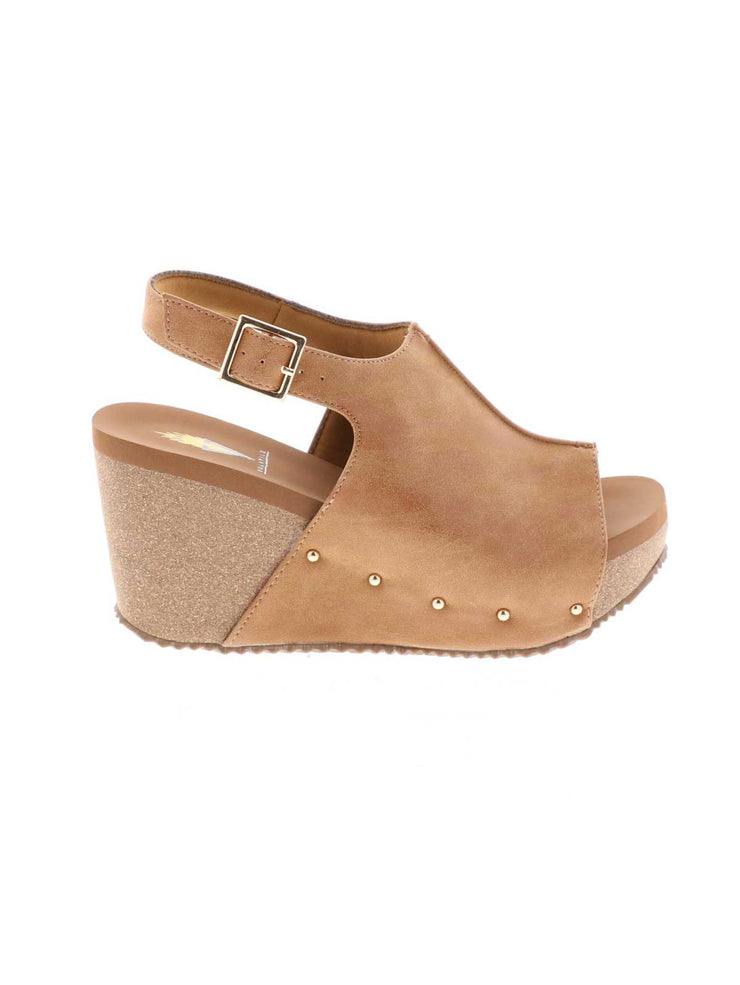One of Volatile’s classic signature styles, the tan Division wedge sandal brings ultra-comfort to casual fashion like no other. The adjustable ankle strap offers stability, the padded lining and signature ultra-comfort EVA insole keeps feet feeling rested even after a full day of adventure, and the rubber traction outsole means these are safe for walking on any surface. Pack these for your next trip to wear with shorts for sightseeing and a flowy dress for special events.